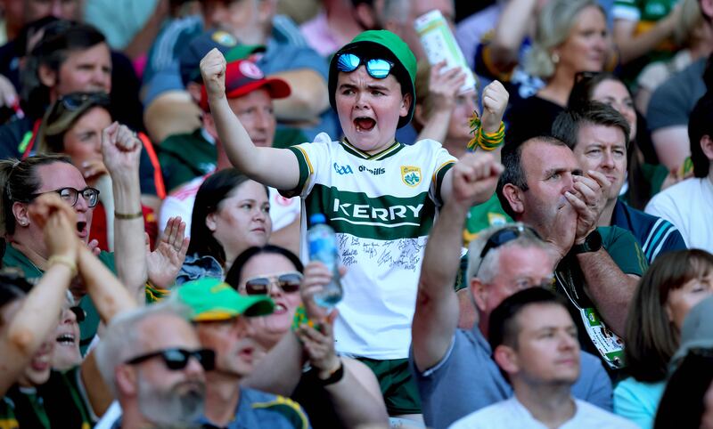 A Kerry fan celebrates a score at Croke Park. Photograph: Ryan Byrne/Inpho