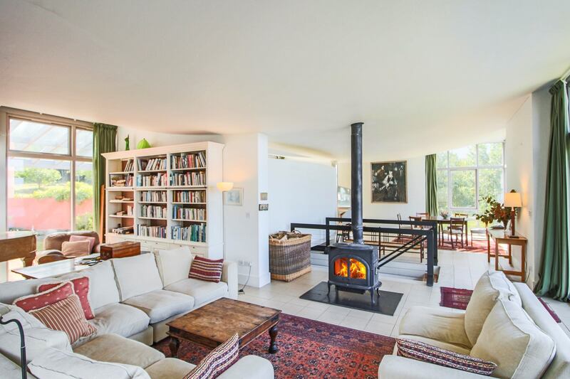 The living area is warmed by a stove