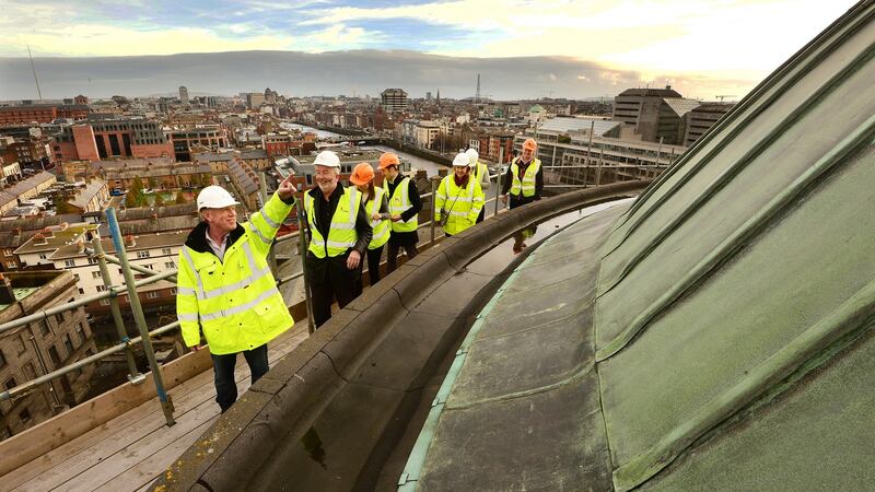 Paul Condon, district inpector at the OPW with conservation architect John Cahill at the circular wall of the outside of the Dome. Photograph: Cyril Byrne/ The Irish Times