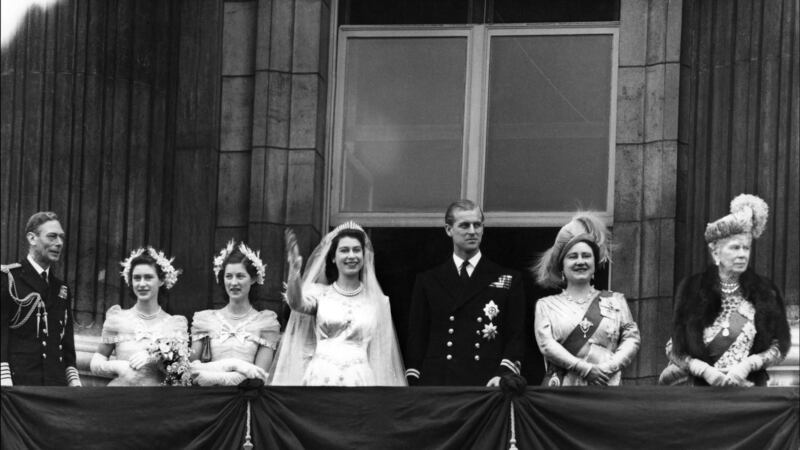 Princess Elizabeth waves from the balcony of Buckingham Palace alongside her husband Philip in November 1947. Photograph: Getty Images