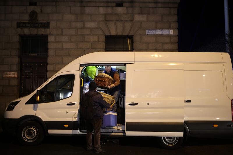 Michael Collins, a driver for the Muslim Sisters of Éire, unloads the van for the Friday night GPO meal. Photograph: Chris Maddaloni