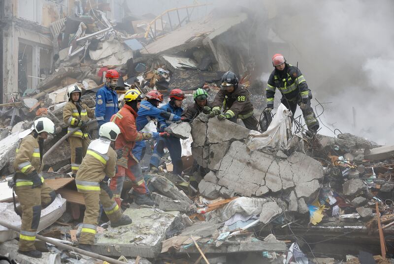 Rescuers work at the site of a Russian strike on a nine-storey residential building in Kyiv. Photograph: Sergey Dolzhenko/EPA
