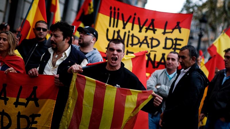 A protester shouts as he holds a Catalan flag during a demonstration called by far-right groups against a referendum on independence for Catalonia. Photograph: Pau Barrena/AFP/Getty Images