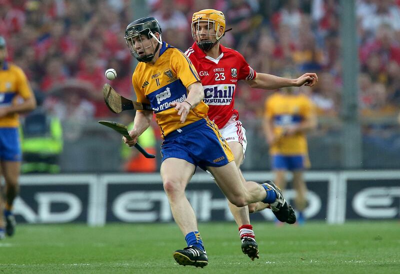 Clare's Tony Kelly and Cathal Naughton of Cork in action during the 2013 All-Ireland senior hurling replay at Croke Park. Photograph: Ryan Byrne/Inpho