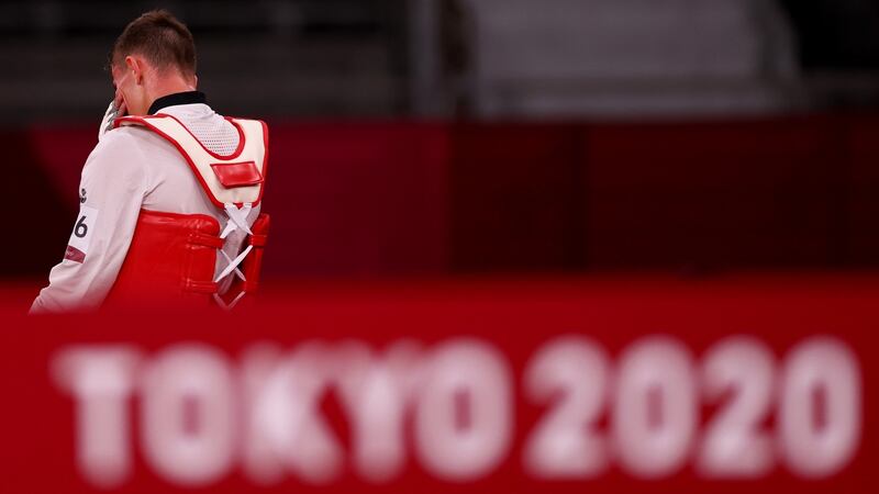Jack Woolley leaves the arena after being beaten by Lucas Guzman. Photo: James Crombie/Inpho