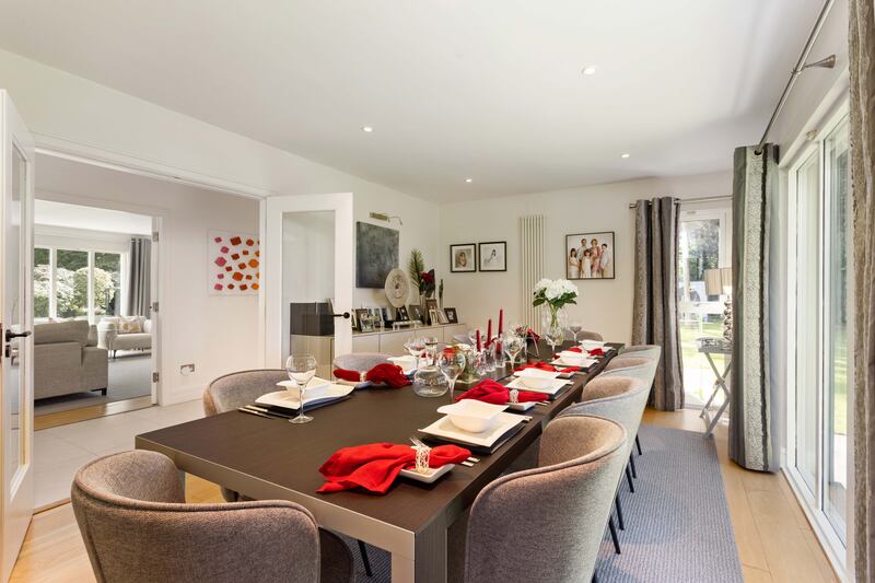 The diningroom has floor-to-ceiling windows looking out to the back.