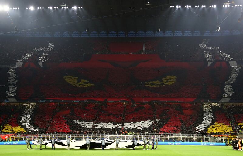 AC Milan fans forming the shape of a devil before the Champions League semi-final against Inter Milan. Photograph: Marco Luzzani/Getty Images