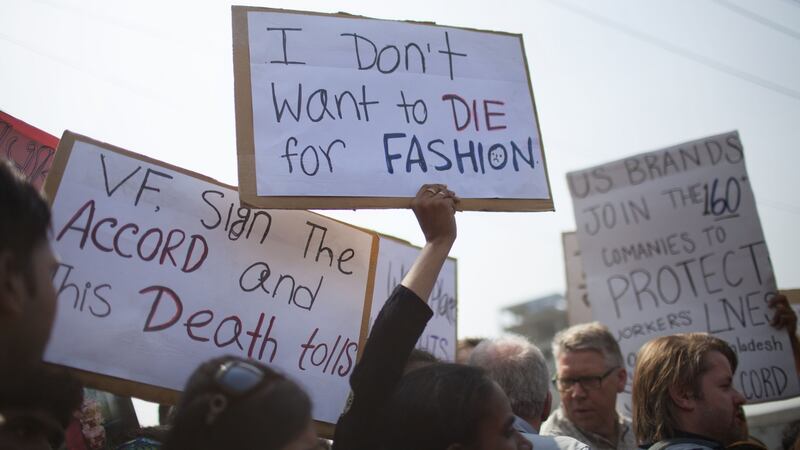 People mourn as they gather in remembrance of those who lost their lives in the collapse of the Rana Plaza buildingPhotograph: Probal Rashid/LightRocket/Getty