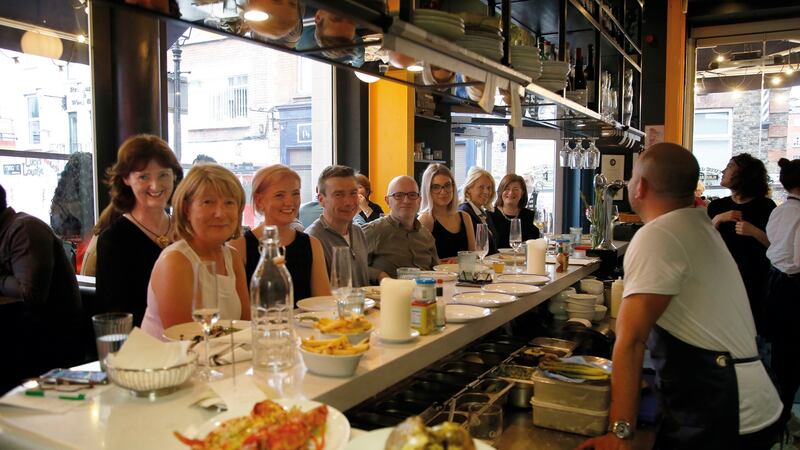 Marie-Claire Digby (left) with club members  Bernie Collins, Molly O’Dwyer, Raymond Magourty, Kevin Cooney, Hannah Barkhoff, Madeleine Gervais and Susan James, and chef Niall Sabongi