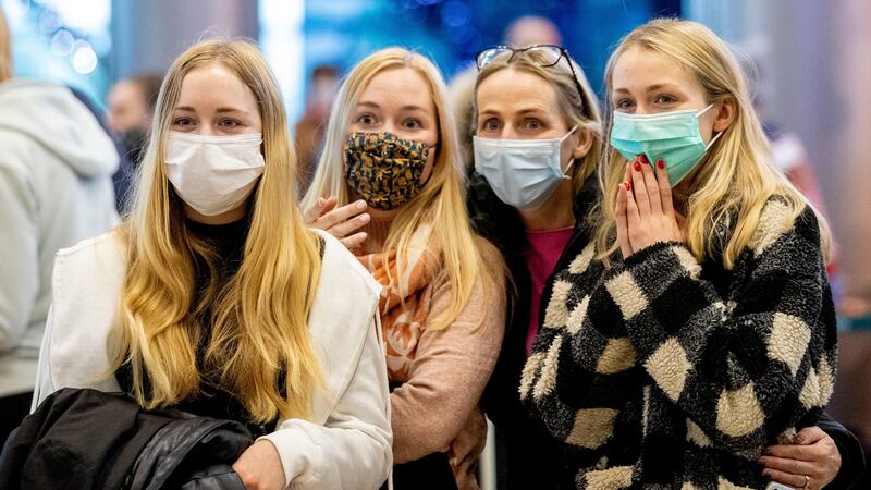 Waiting for Dad: The Kenny family (Eilis, Síne, mother Claire and Cera) from Naas, Co Kildare, waiting for their father Brendan Kenny,  arriving in from Somalia. Photograph: Tom Honan
