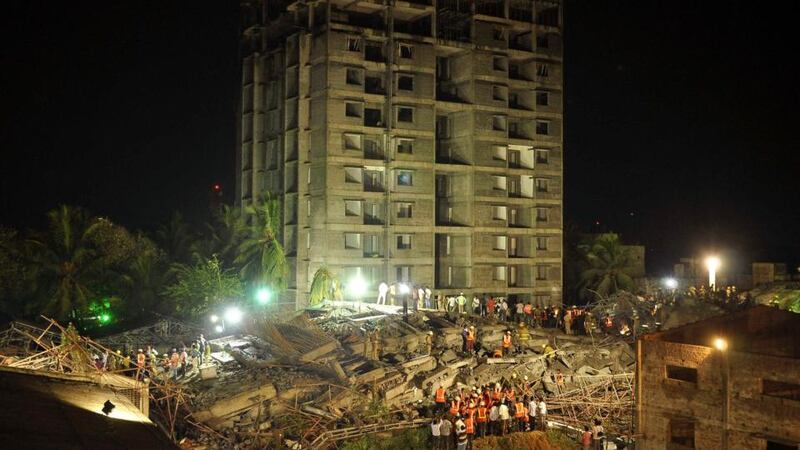 Rescue workers conduct a search operation for survivors at the site of a collapsed 11-storey building that was under construction on the outskirts of the southern Indian city of Chennai. Photograph: Reuters