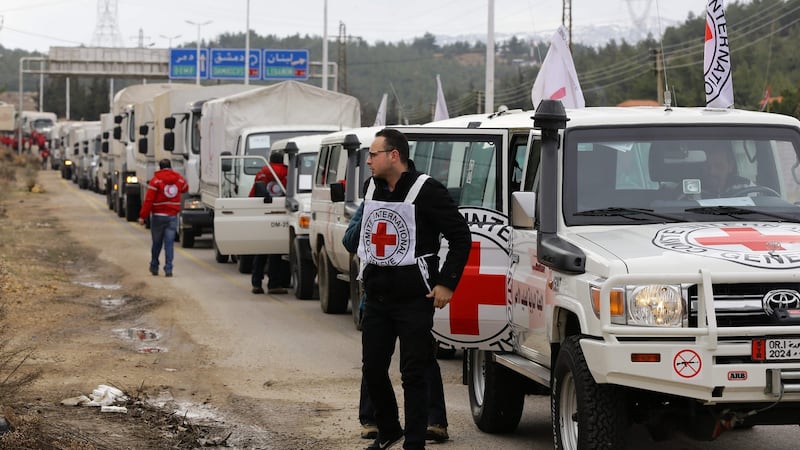 A convoy of aid from the International Committee of the Red Cross (ICRC) waits on the outskirts of the besieged rebel-held Syrian town of Madaya before entering it, on January 11th, 2016. Photograph: Louai Beshara/AFP/Getty Images