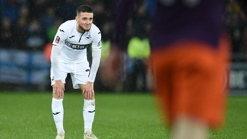 Swansea City’s   Matt Grimes reacts after losing the  match. Photo: Getty Images