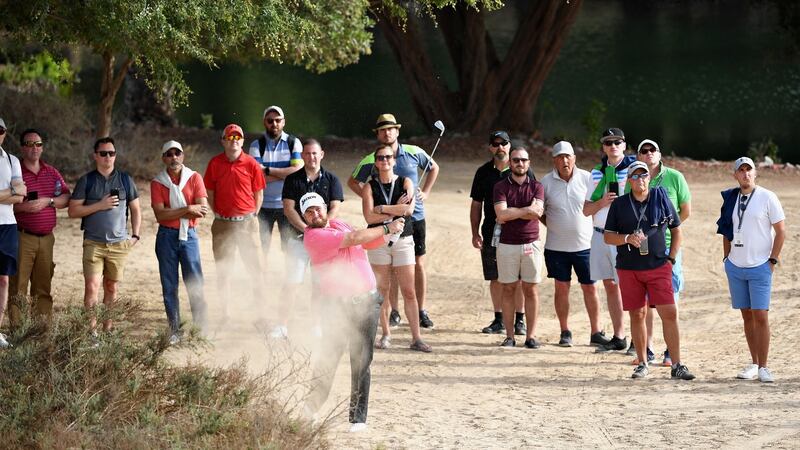 Ireland’s  Shane Lowry takes his second shot on the 12th hole  during the second round of the Omega Dubai Desert Classic. Photograph: Ross Kinnaird/Getty Images