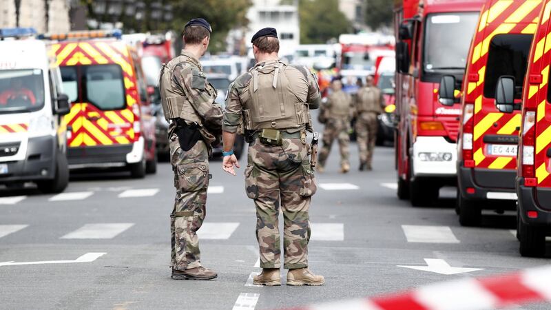 Military forces establish a security perimeter near Paris police headquarters. Photograph: Ian Langsdon/EPA
