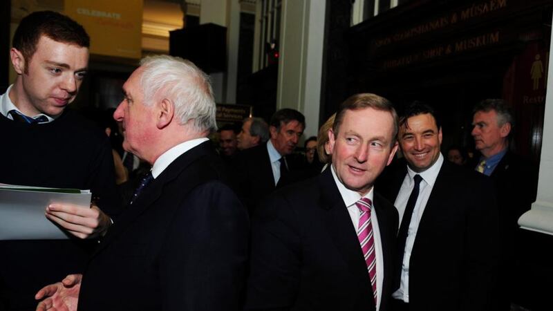 Taoiseach Enda Kenny TD walks past former taoiseach Bertie Ahern at the launch of the Ireland 2016  programme of events to mark the centenary of the  1916 Rising. Photograph: Aidan Crawley.