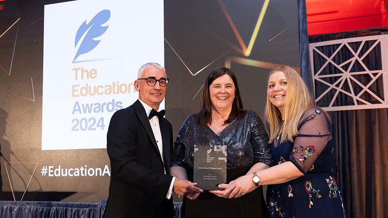 Joseph Collins, awards judge, presents the career impact strategy award to Brianna Madden and Marie Laffey, University of Galway