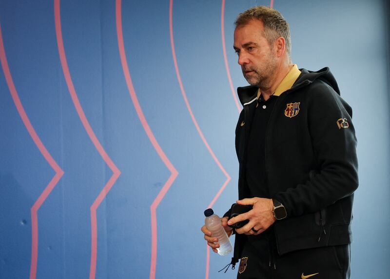 Barcelona manager Hansi Flick arriving for a press conference - on time, presumably. Photograph: Lluis Gene/AFP via Getty Images          