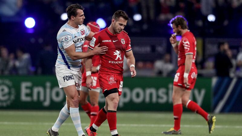 Toulouse’s Zack Holmes is consoled by Juan Imhoff of Racing after being red carded for a dangerous high tackle during the Champions Cup quarter-final in Paris. Photograph: Dan Sheridan/Inpho