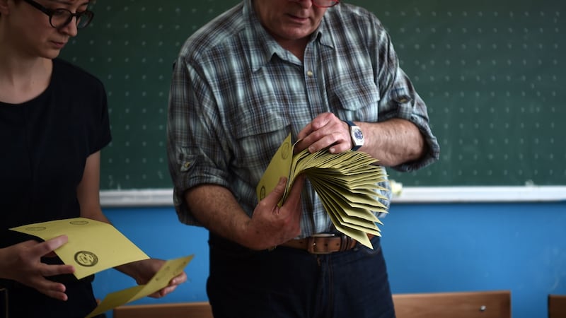 An electoral staff member counts ballots paper in an Istanbul polling station. Photograph: AFP/ Ozan Koseozan Kose