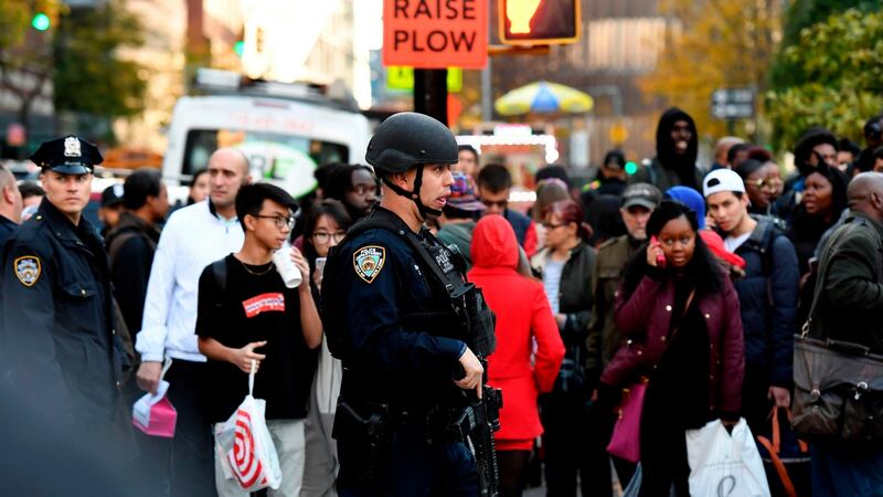 A suspect exited the vehicle holding up fake guns, before being shot by police and taken into custody. Photograph: Don Emmert/AFP/Getty Images