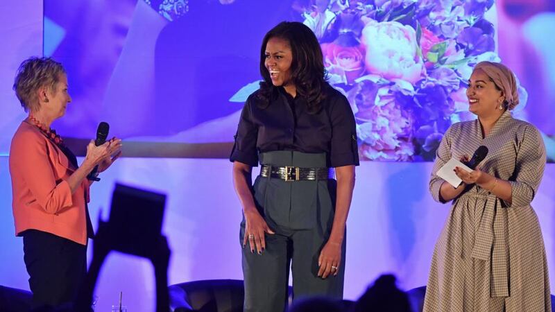 Former US first lady Michelle Obama on stage at Elizabeth Garrett Anderson School in London with executive headteacher Jo Dibb and girls’ education activist Nusrath Hassan. Photograph: Ben Stansall/AFP/Getty Images