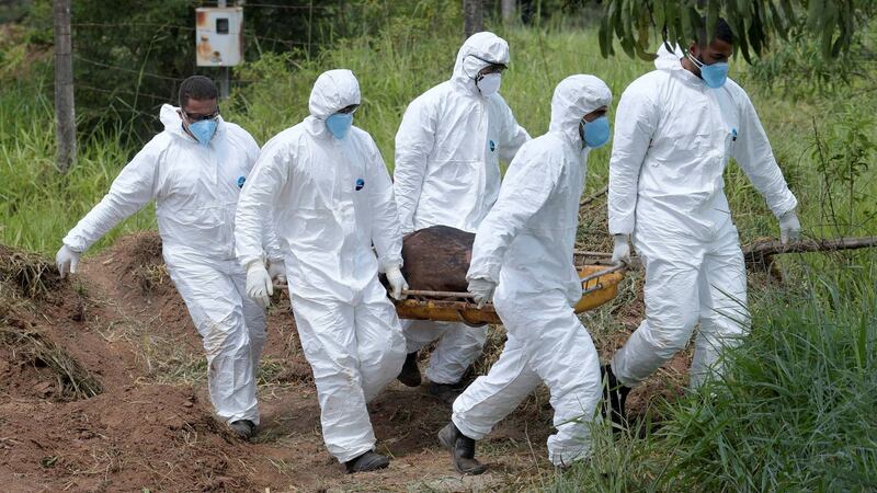 Members of a rescue team carry a body recovered after a tailings dam owned by Brazilian mining company Vale SA collapsed, in Brumadinho. Photograph: Washington Alves/Reuters