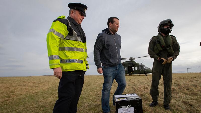 Ballot boxes arrive on Inishbofin Island from an Air Corps helicopter in Co Donegal. Photograph: Colin Keegan, Collins Dublin