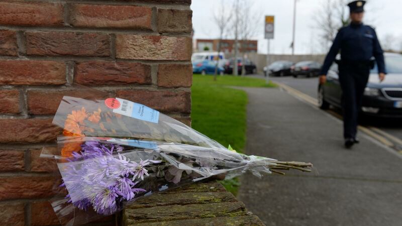 Flowers placed near the house where the bodies of Conor (9), Darragh (7) and Carla McGinley (3) were discovered. Photograph: Caroline Quinn/PA Wire