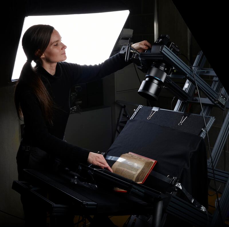 Caroline Harding photographs manuscripts so they can be digitised. Photograph: Trinity College Dublin