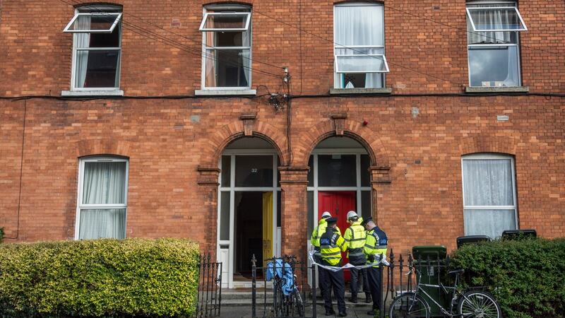 Gardaí and members of the Dublin Fire Brigade Fire Prevention division  at the house in Grove Park,  Rathmines, where a a man died after a fire on Thursday. Photograph: Brenda Fitzsimons/The Irish Times