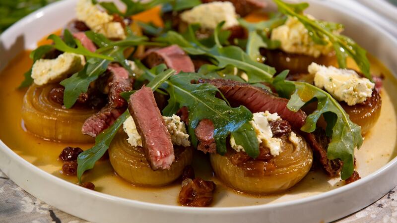 Steak with slow-roasted onions, Boursin and raisins. Photograph: Patrick Browne