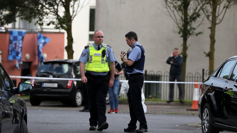 Gardaí at the scene of a shooting incident in the Castlecurragh Heath area of Mulhuddart, Dublin on Saturday. Photograph: Brian Lawless/PA Wire.
