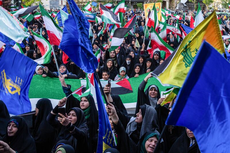 Demonstrators show their support for Iran’s attack on Israel in Palestine Square in Tehran, Iran. Photograph: Arash Khamooshi/New York Times
                      