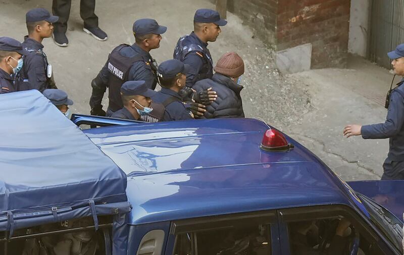 Nepalese police escort Charles Sobhraj, in brown cap, to the immigration office, in Kathmandu on December 23rd, 2022. Photograph: Niranjan Shrestha /AP Photo
