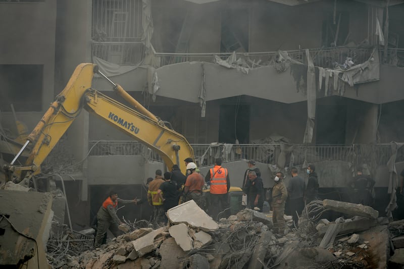 Rescue workers searching for victims at the site of an air strike in central Beirut. Photograph: AP Photo/Hassan Ammar