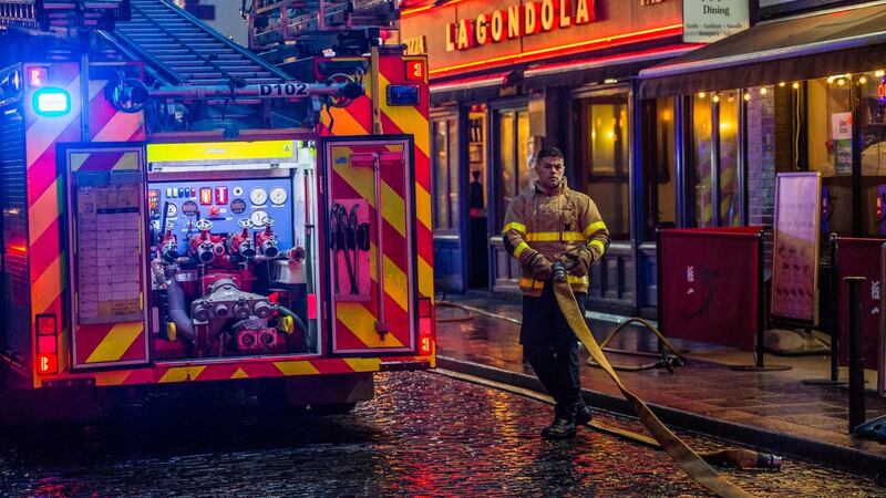 A fireman is seen  in the Temple Bar area where a fire led to the evacuation of an apartment complex.  Photograph: James Forde/The Irish Times.