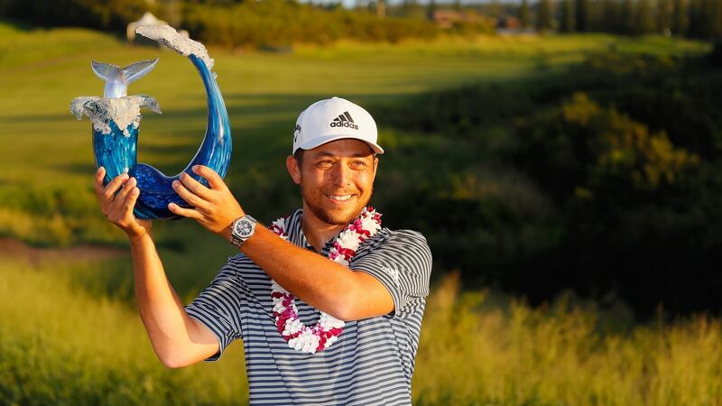 Schauffele poses with the trophy after winning. Photo: Kevin C. Cox/Getty Images