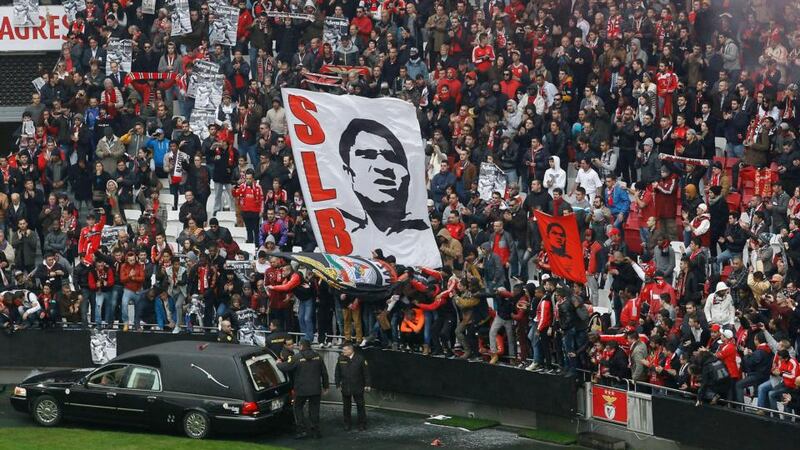 The hearse carrying Eusebio’s coffin is driven around the Estadio Da Luz in Lisbon. Photograph: Hugo Correia/Reuters