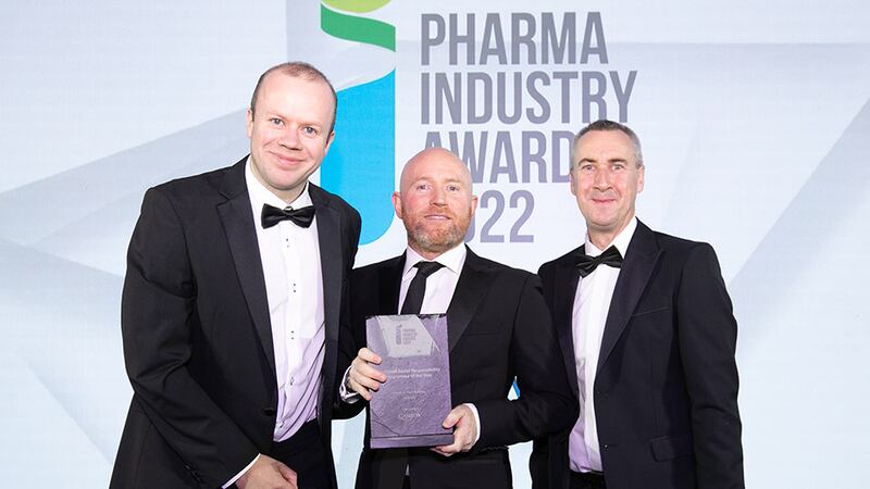 Tom Gleeson, Finance Director, Camida, presents the Corporate Social Responsibility Programme of the Year award to Andrew Shaw and Colm Doyle, Abbvie.