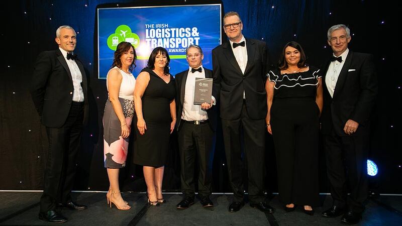 Jamie Rohan, Managing Director, Rohan Holdings presents the Logistics Company of the Year award to the BWG Foods team.