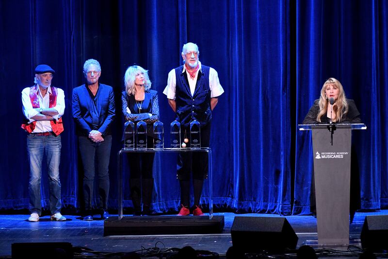 ‘The smirking incident’: John McVie, Buckingham, Christine McVie and Fleetwood look on as Stevie Nicks speaks at the MusiCares event in 2018. Photograph: Dia Dipasupil/Getty