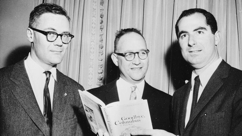 March 24th, 1960:  The three winners of the National Book Award, Robert Lowell, from left, Richard Ellmann and Philip Roth, who received the award in the fiction category for his book Goodbye, Columbus at the Astor Hotel in New York City. File photograph: AP