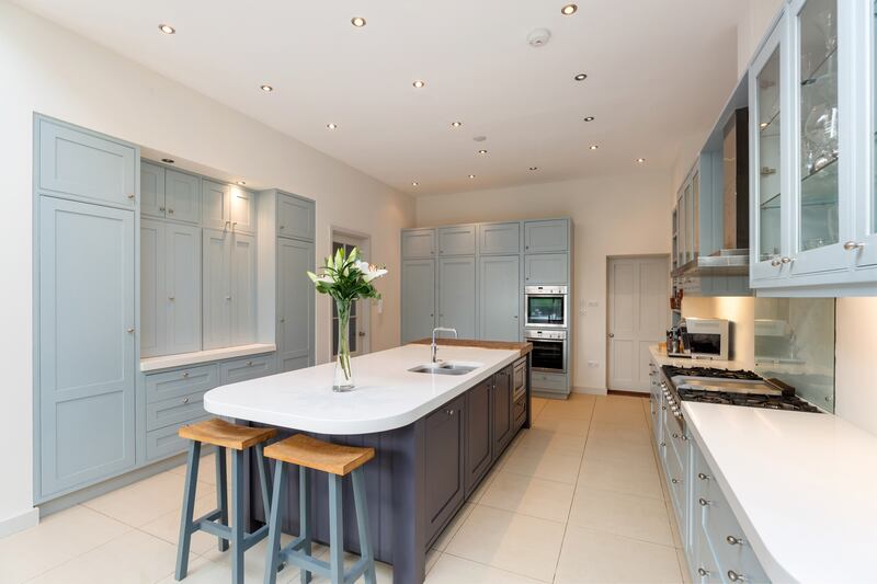 The kitchen is set back towards the centre of the house, but a large rooflight keeps it brightly lit.