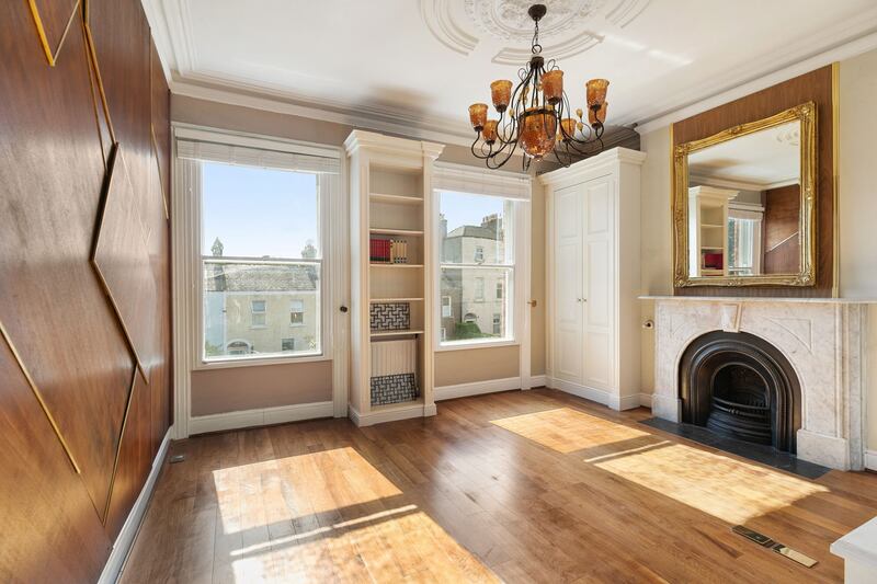 Bedroom with feature walnut wall