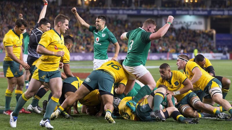Conor Murray and Tadhg Furlong celebrate  CJ Stander’s try. Photograph: Reueters