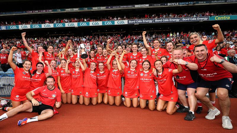 The Cork team celebrate with the Jack McGrath Cup. Photograph: Ben Brady/Inpho