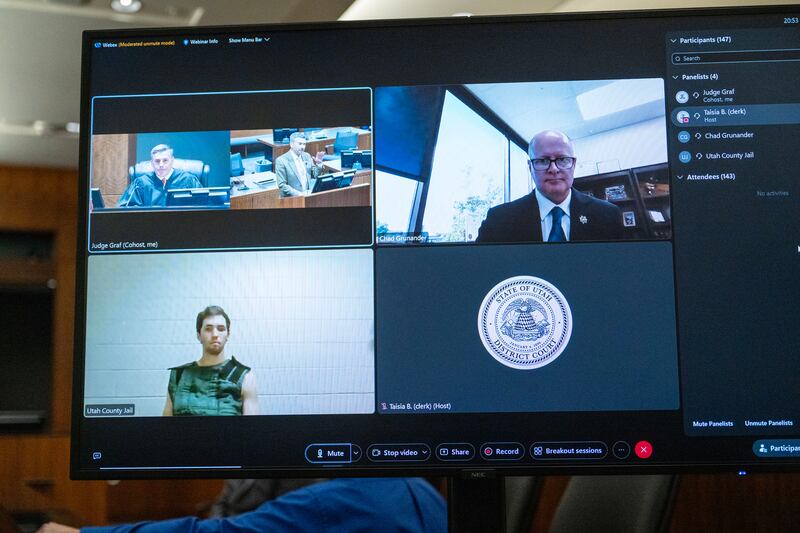 Tyler Robinson, the suspect in the fatal shooting of Charlie Kirk, appears remotely via video, along with Utah County prosecutor Chad Grunander, during a hearing before judge Tony Graf. Photograph: Scott G Winterton-Pool/Getty 