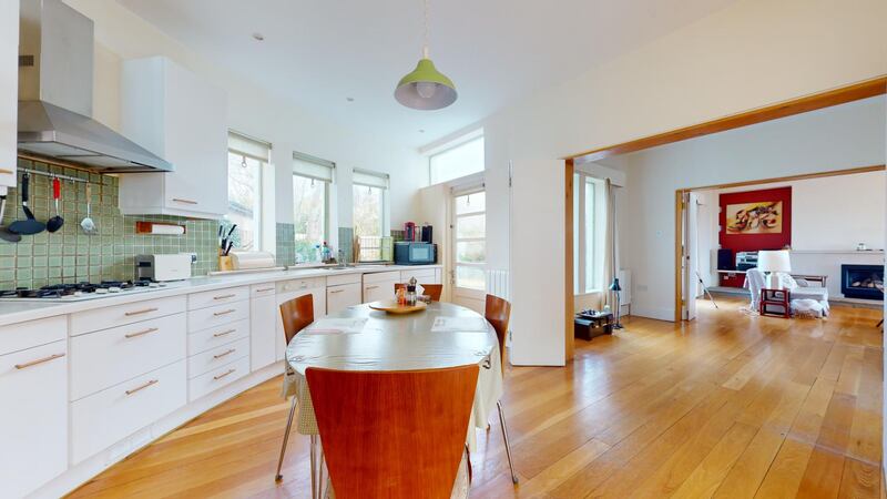 Kitchen and connecting room into livingroom