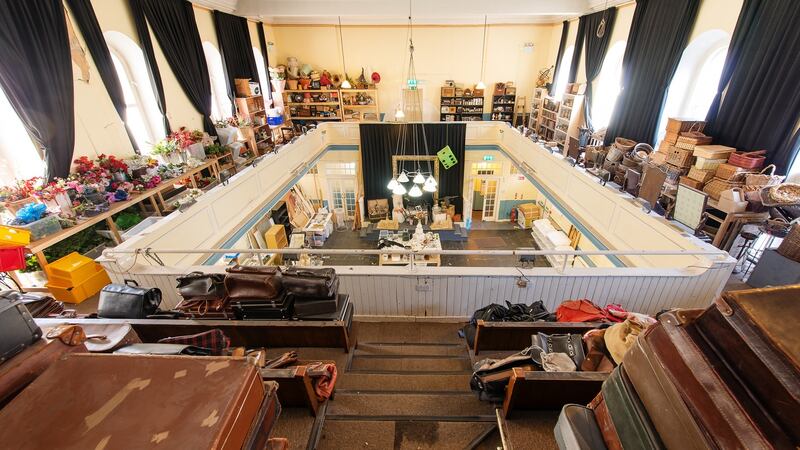 The property has a light-filled church extending across the entire width of the building with an overhanging balcony wrapped around the hall